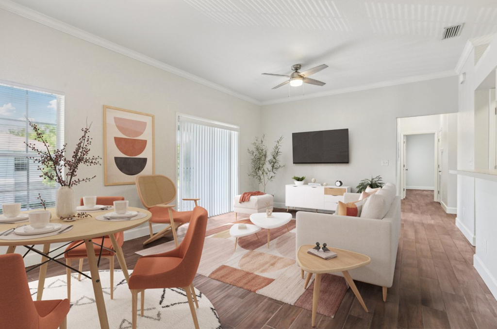 A living room with a dining table and chairs.